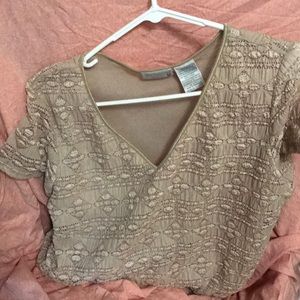 Cream colored short sleeved shirt